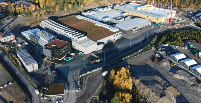 Aerial view of EcoDataCenter campus with multiple buildings and trees in autumn. Aerial view of EcoDataCenter campus with multiple buildings and trees in autumn.