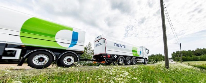 Green HVO100 fuel truck parked on a road with power lines. Green HVO100 fuel truck parked on a road with power lines.